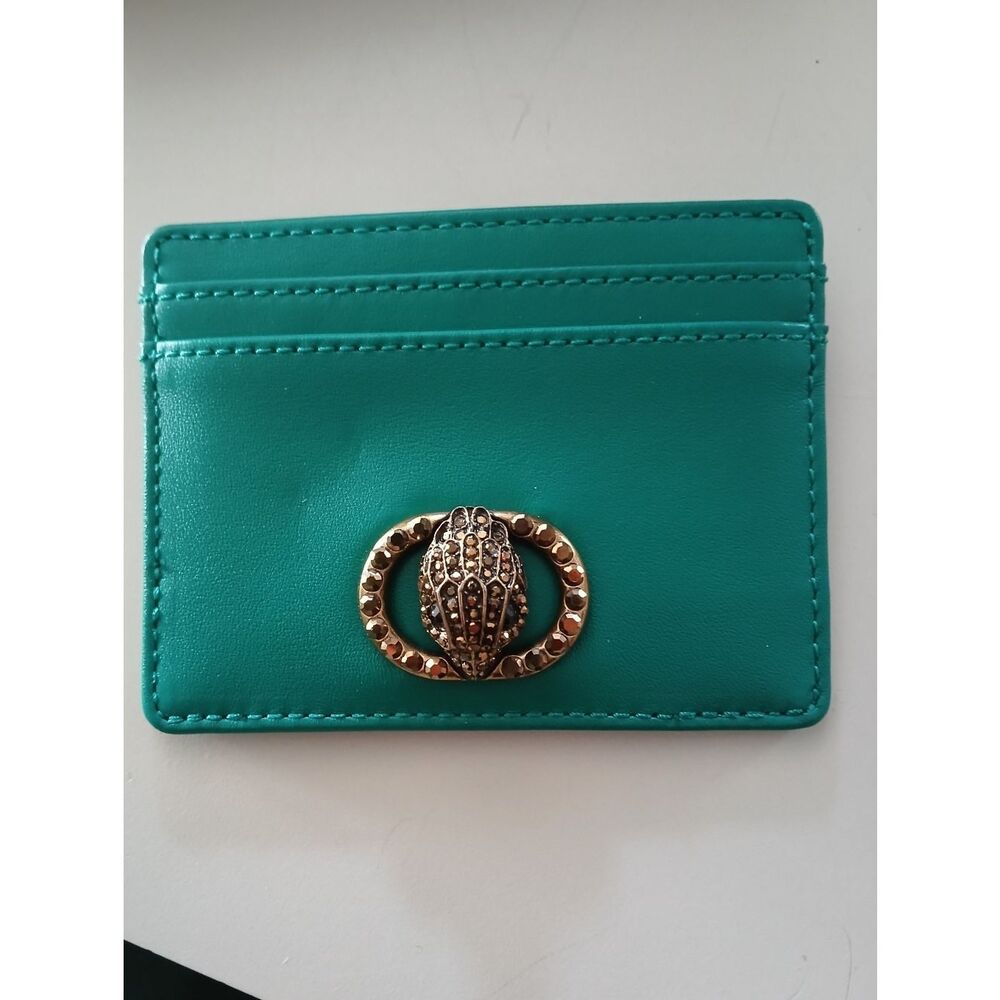 Kurt Geiger teal card holder with gold-tone beetle detail. Orange available too